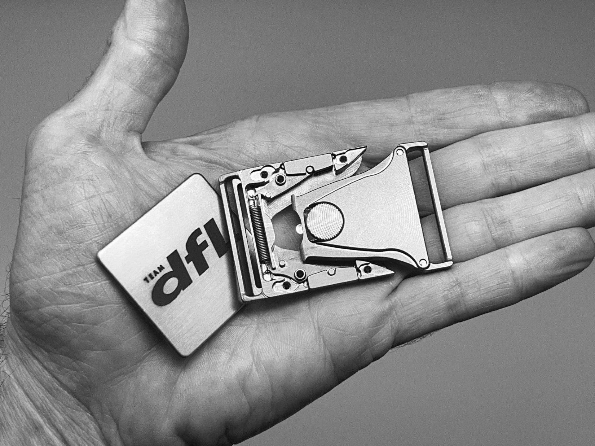 titanium belt buckle in hand